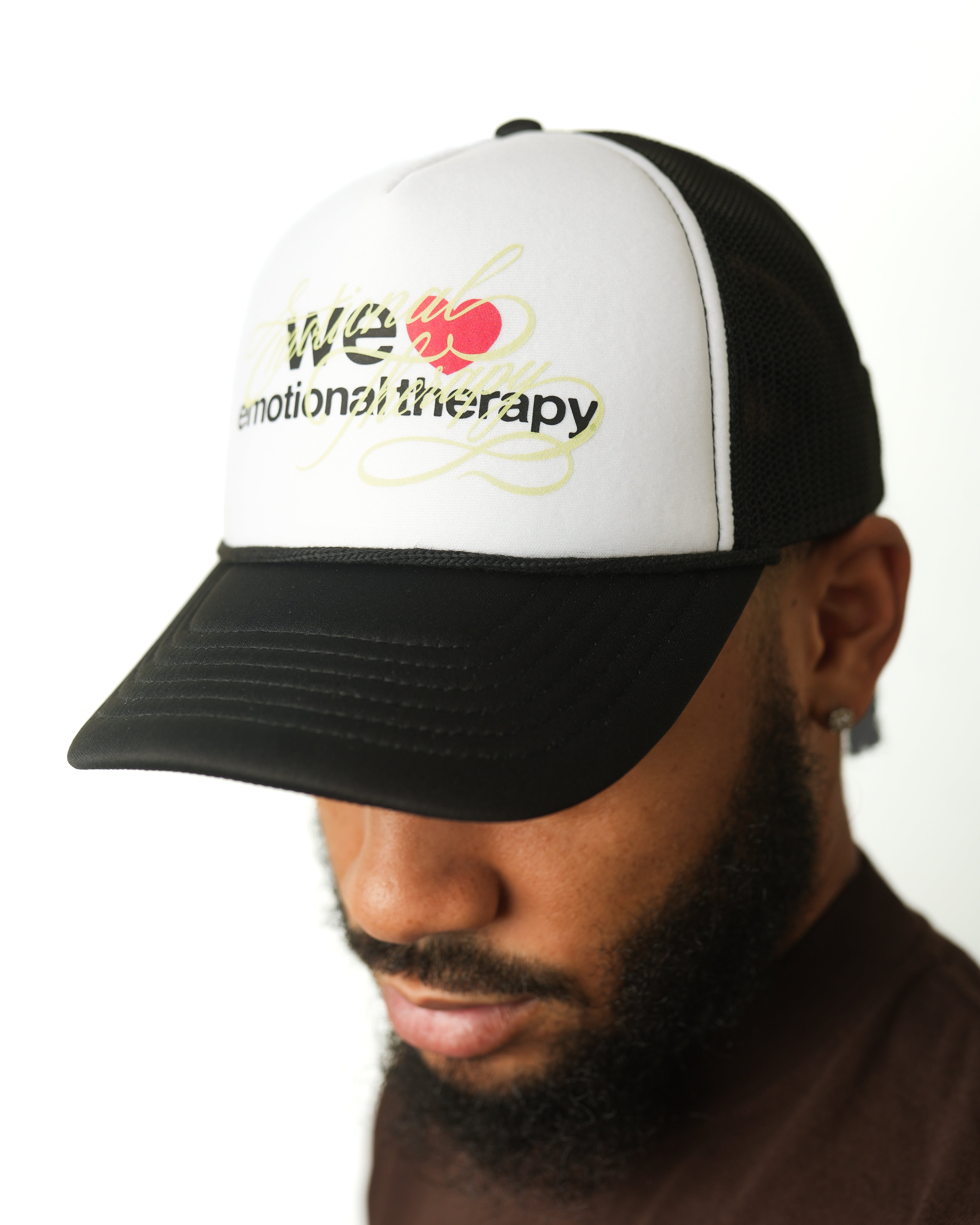 WE ❤️ EMOTIONAL THERAPY TRUCKER CAP (BLACK)